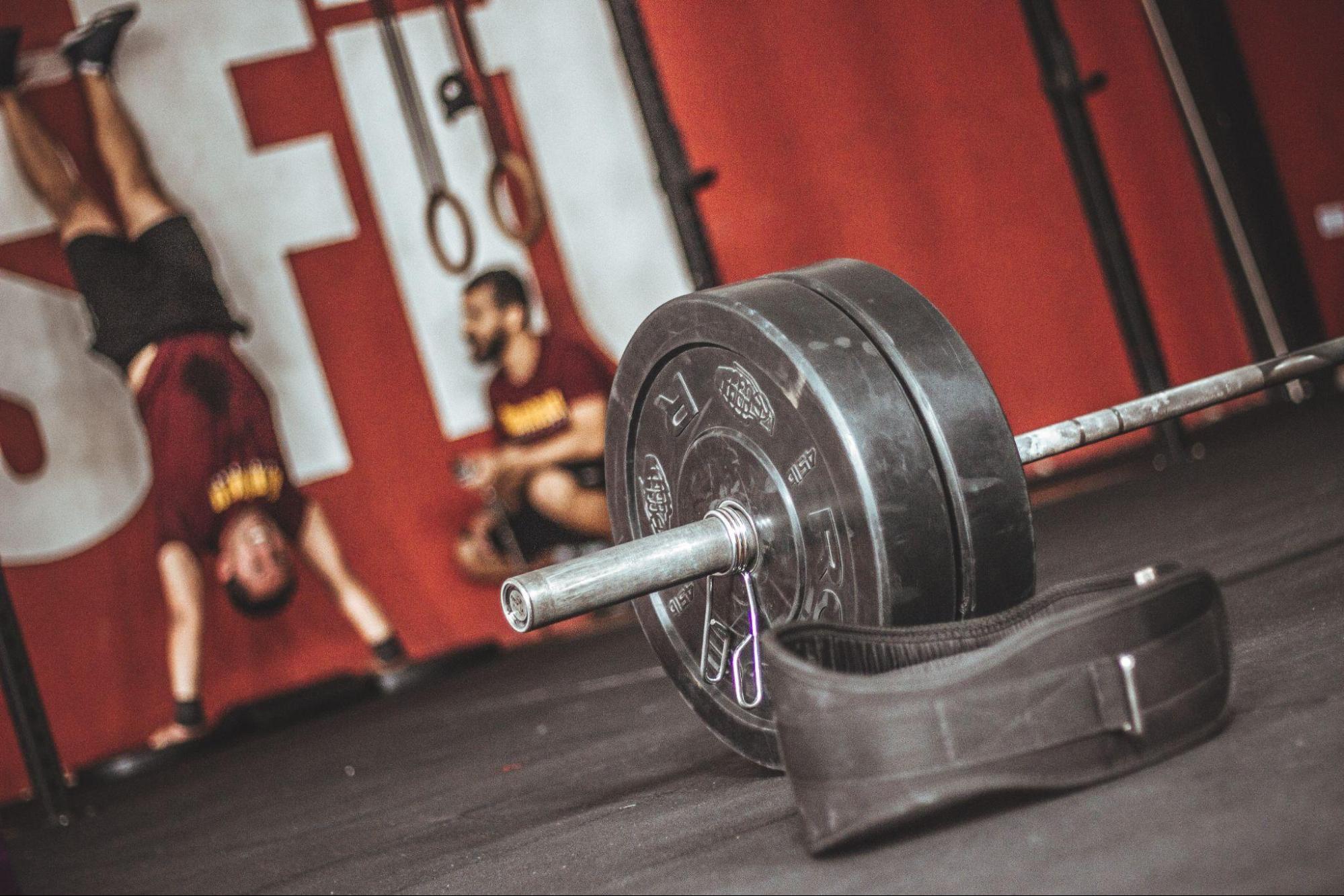 barbell with crossfitters in the background