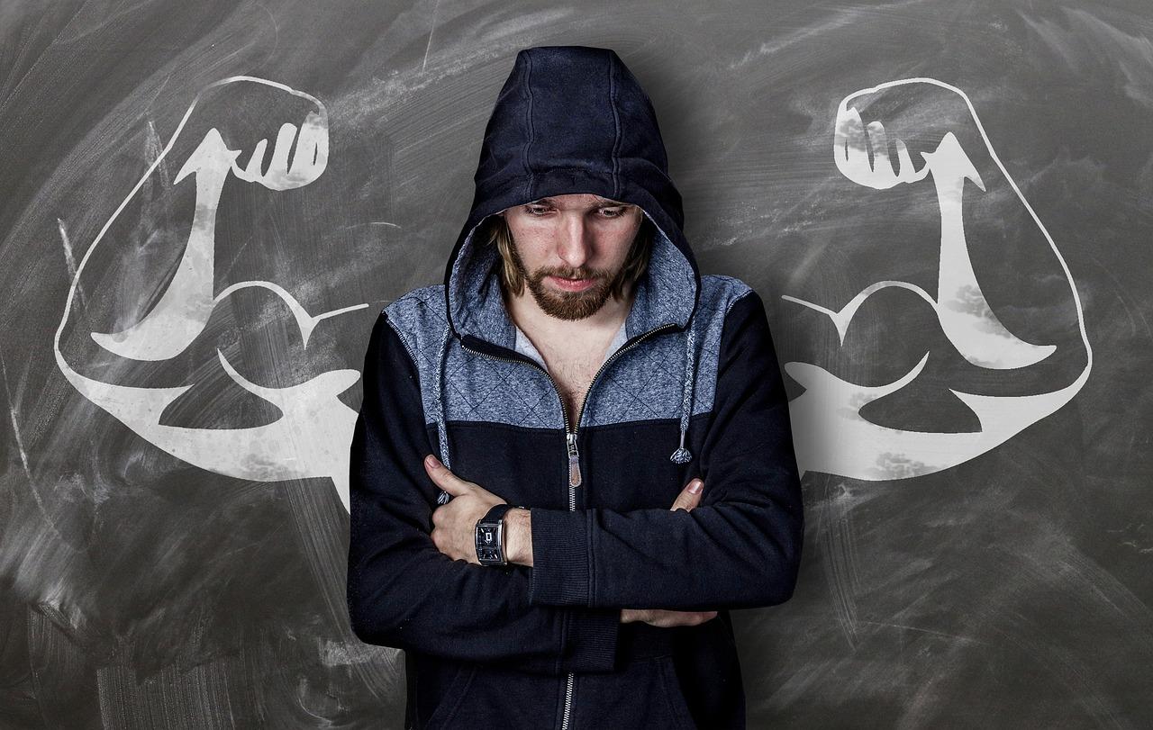  a man with a drawing of muscular arms