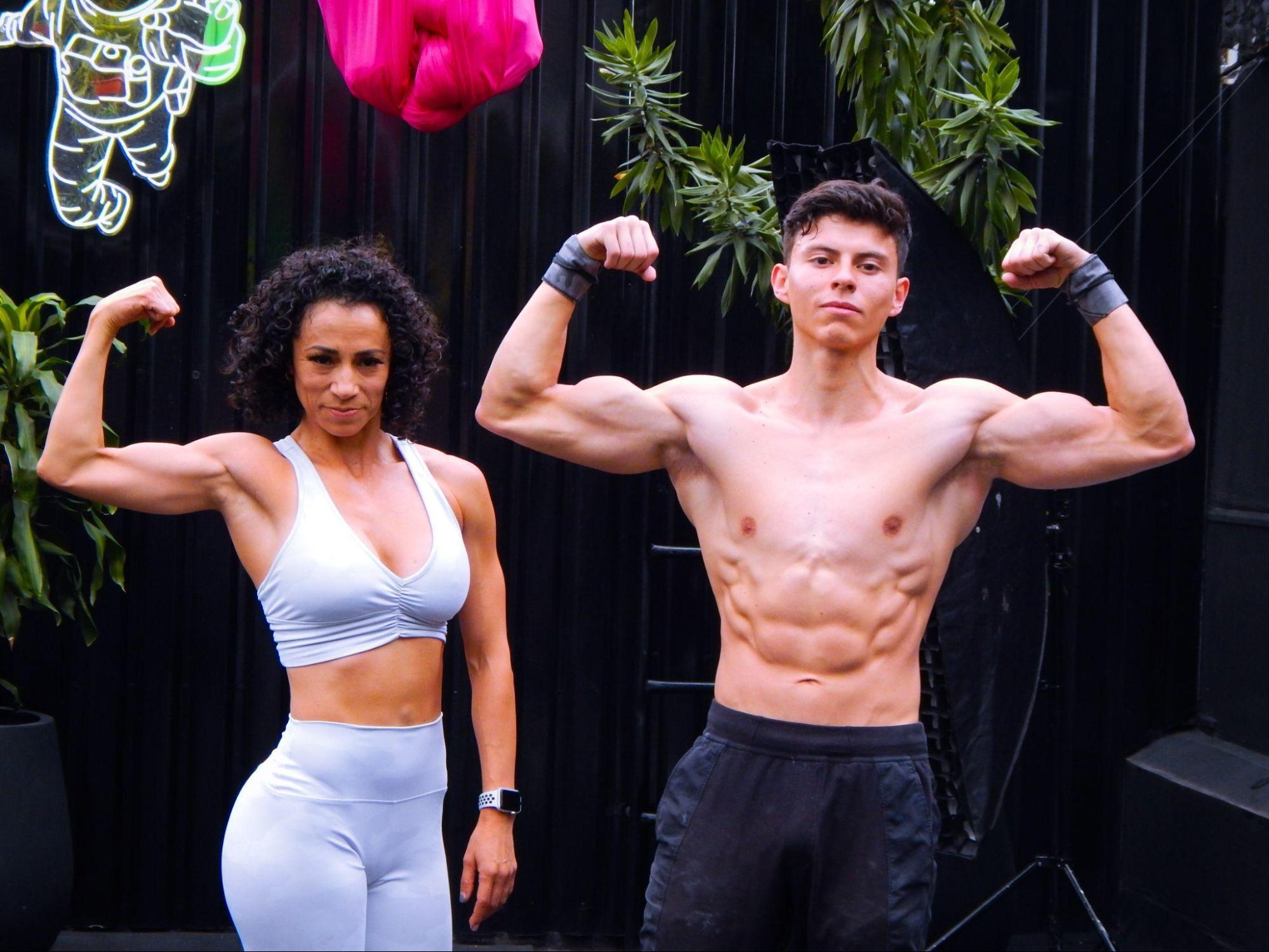 fit man and woman flexing