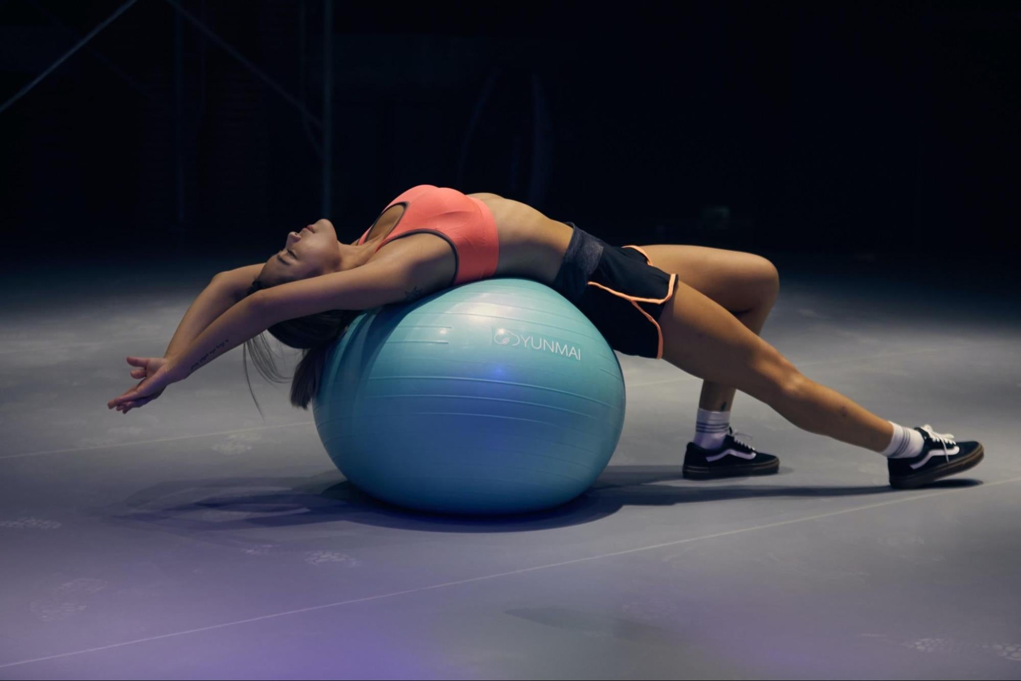 Girl exercising on a ball